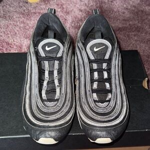 all-black Nike Air Max 97 sneakers